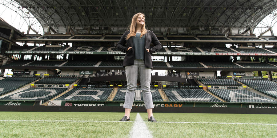 Jensyn Lown standing on the field at Providence Park