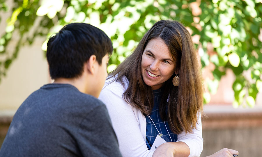 An educator talking with a student