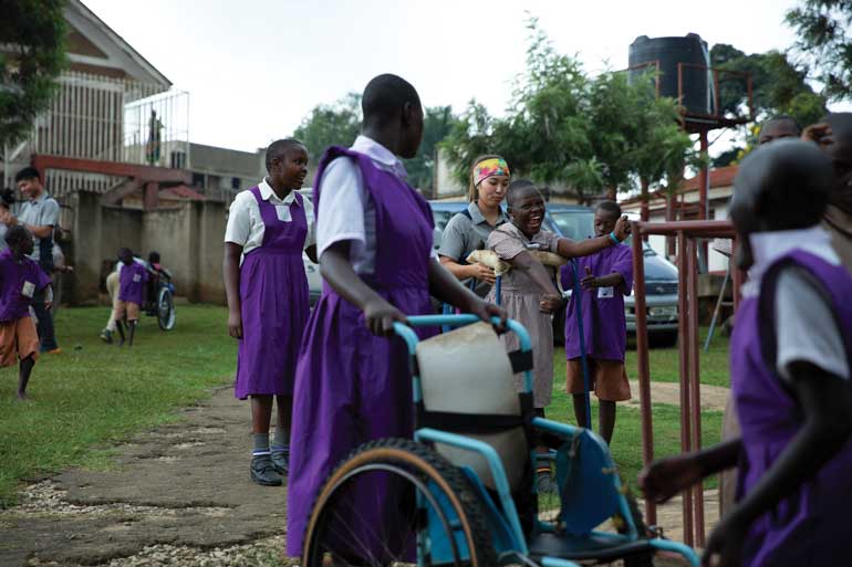 Girl using a wheelchair for assistance