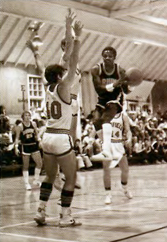 Carter playing basketball at George Fox in 1980