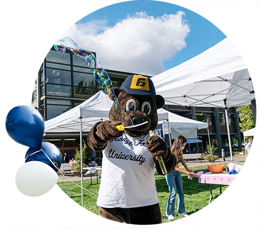 George Fox mascot, Pennington, blowing bubbles