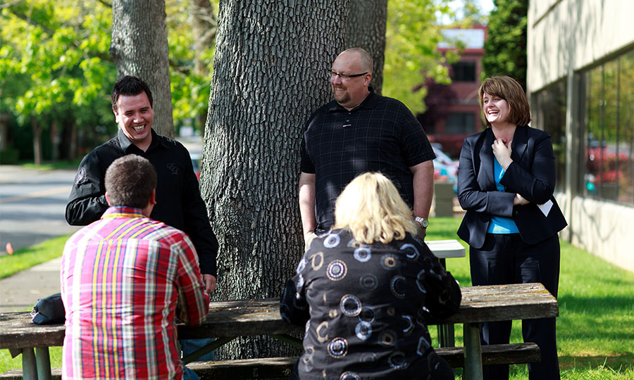 George Fox MBA program students laughing and talking outside