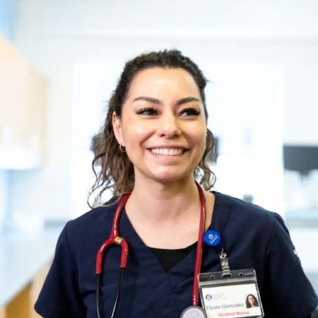 Elysia Gonzalez in nursing uniform