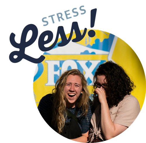 Two women laughing together with the words 'stress less' over the top of it