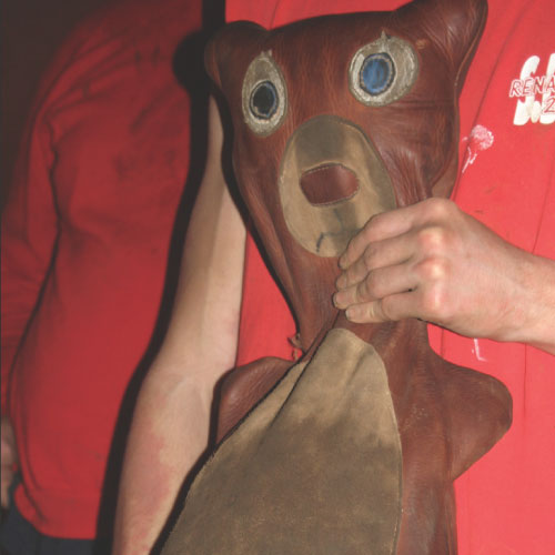 Student holding the bruin brawl bear