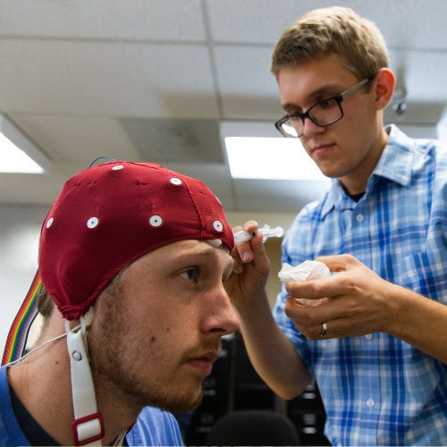 Psyd student conducting an EKG lab