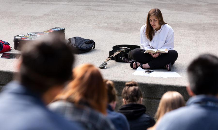 Students worshiping at the amphitheater 