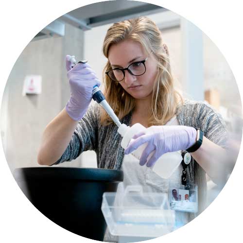 Photo of a focused student in a lab