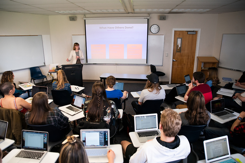 Students sit in a class lecture