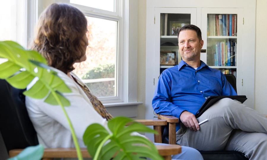 Psychiatric Nurse Practitioner student talking to a patient
