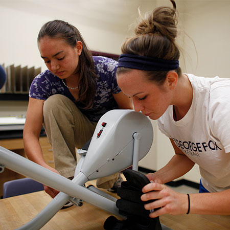 Two engineering students checking an equipment for the public service