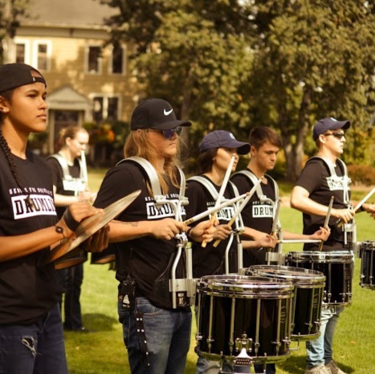Student drumline playing outside