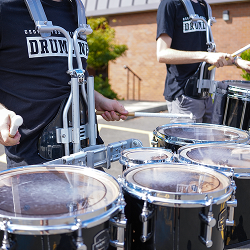 Student practicing drumline