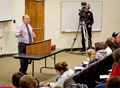 Kerry Irish teaching while C-SPAN cameras look on