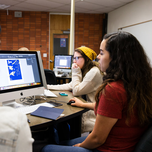 Students work on computers in design class