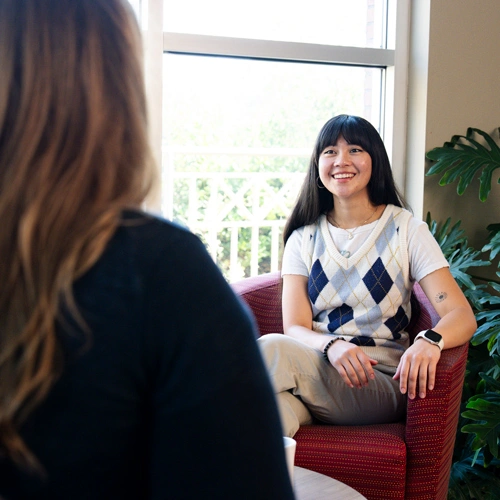 woman speaking with a social worker