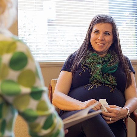 A counselor talking with a client