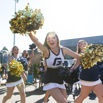 Cheerleaders cheer on the team