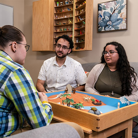 A counselor talking with a couple