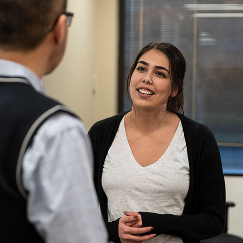 A student in Master of Social Work program talking with a professor