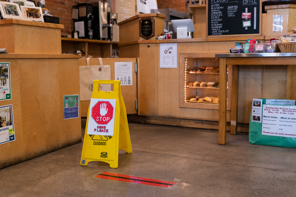 Sign that reads stop at coffee shop