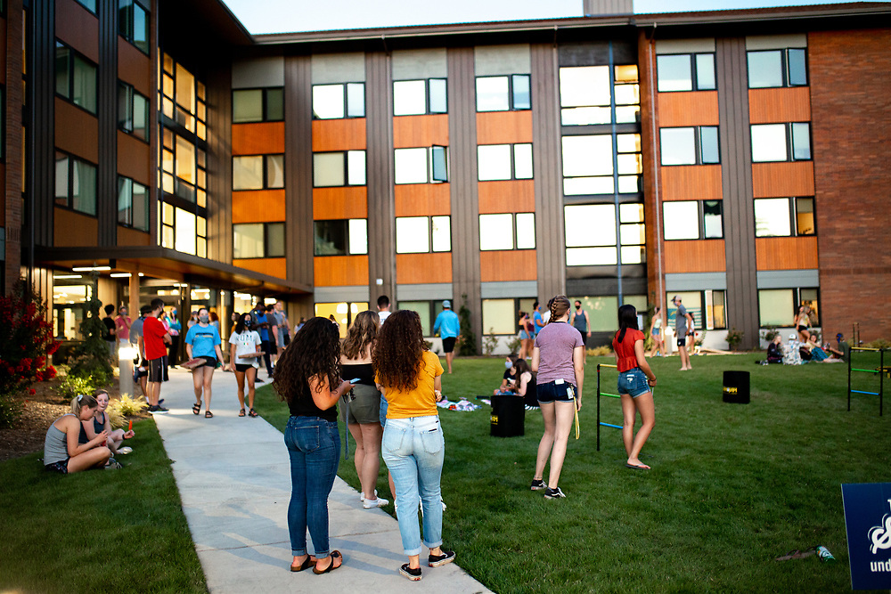 Students play games outside of a dorm