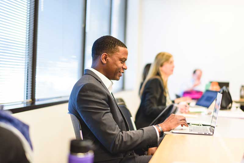 adult degree student with laptop