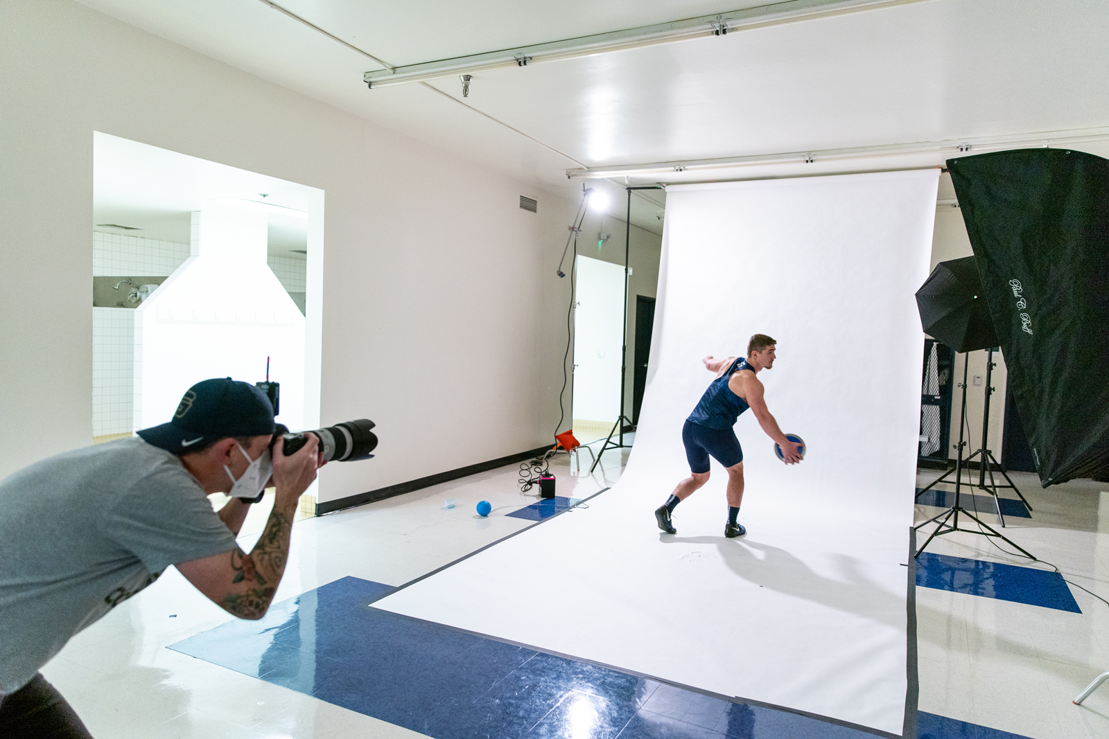 A photographer takes photos of an athlete in action