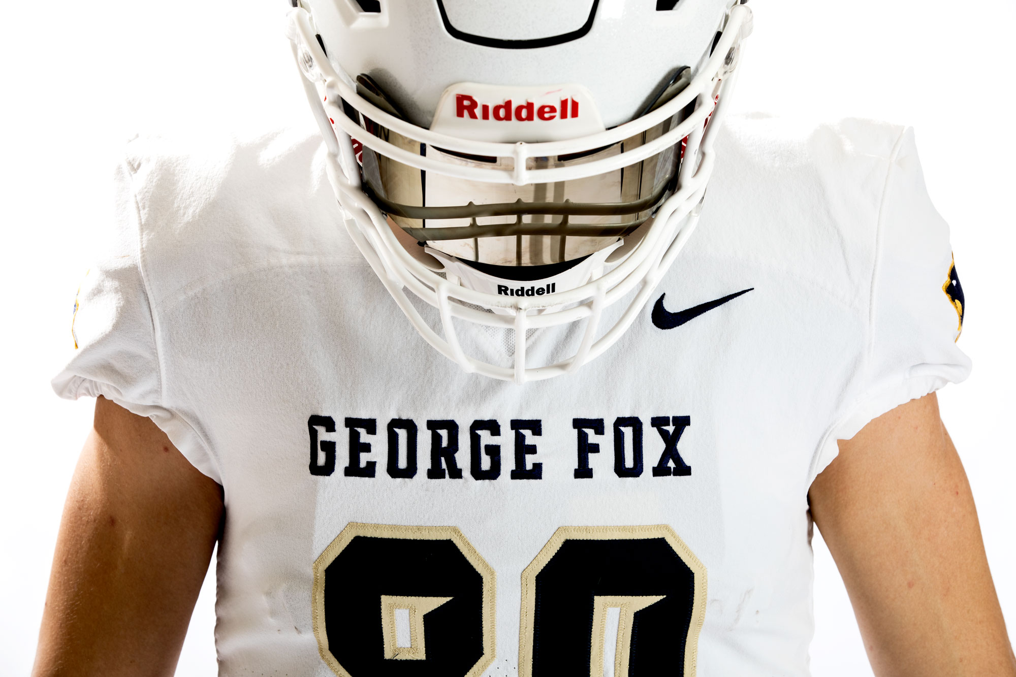 A football player wearing his helmet
