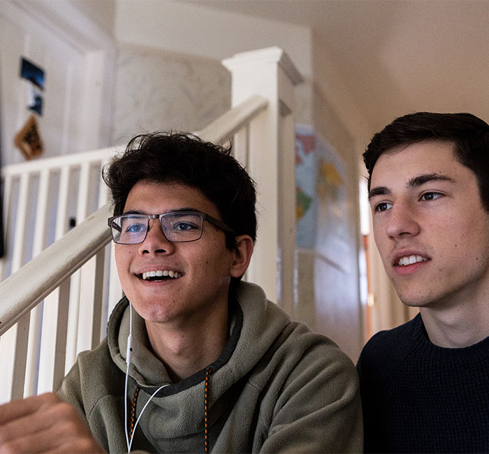 Two students look at a computer screen together