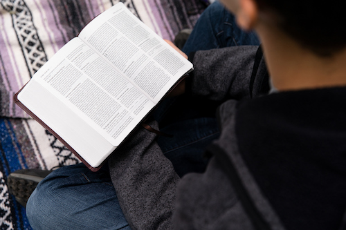 A student reads his Bible
