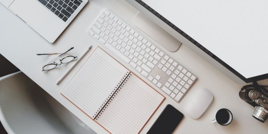 An organized workspace in front of a computer