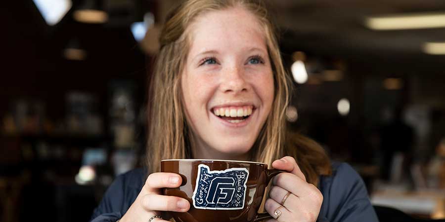 girl smiling with coffee
