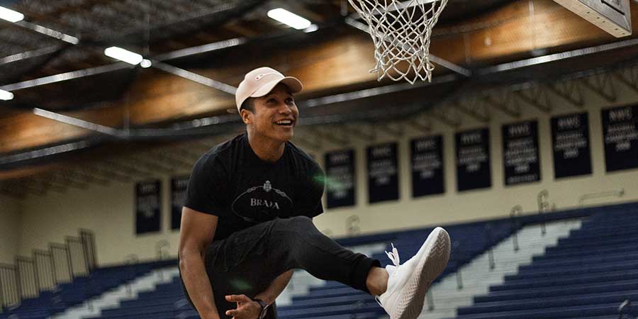 boy dunking basketball