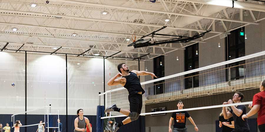 student playing intramural volleyball