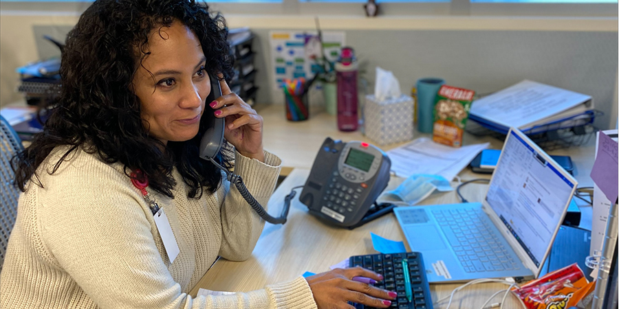 Cynthia Molina at desk