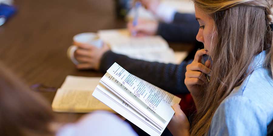 student reading honors book