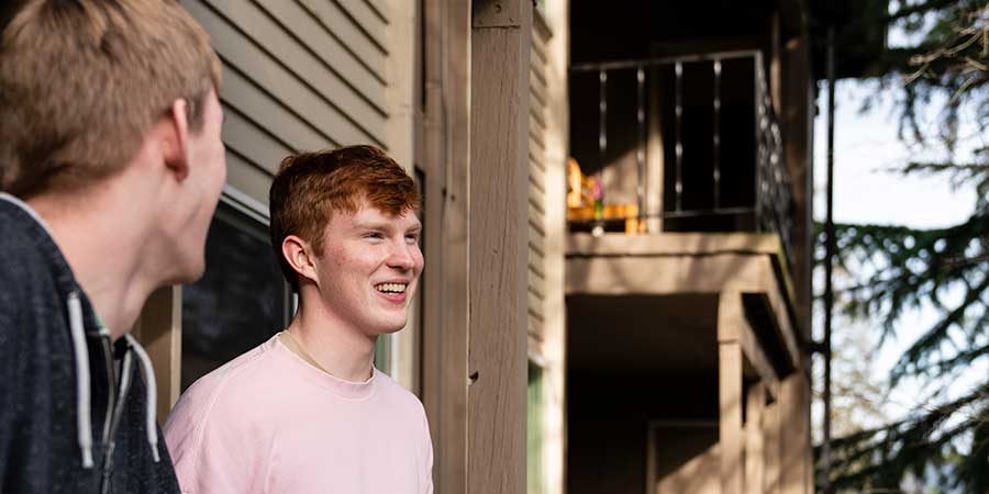 Students on an apartment balcony