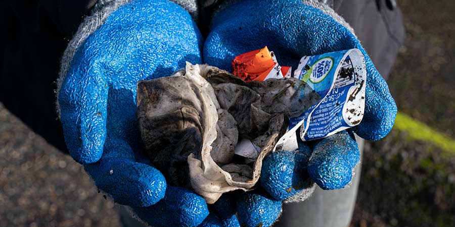 handful of trash in student's hands