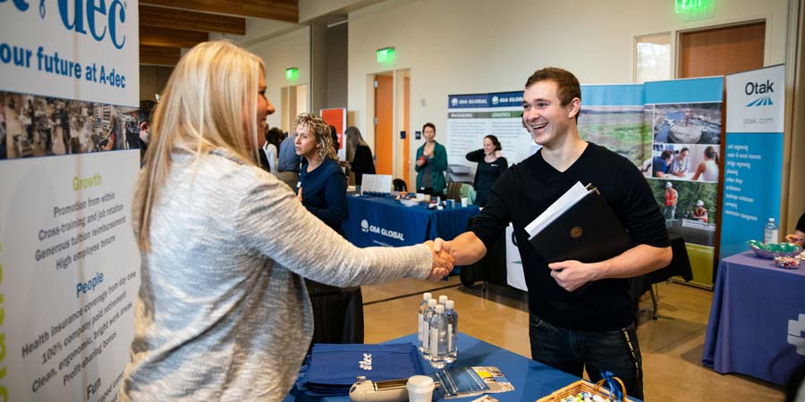 Student and employer shaking hands