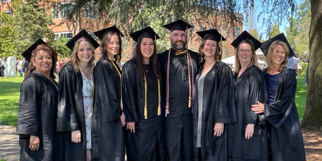 Loretta and her cohort at graduation