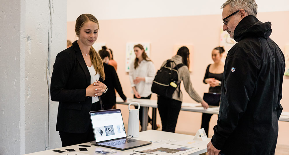 student presenting to professional