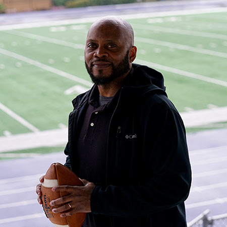 Jake Redmond holding a football