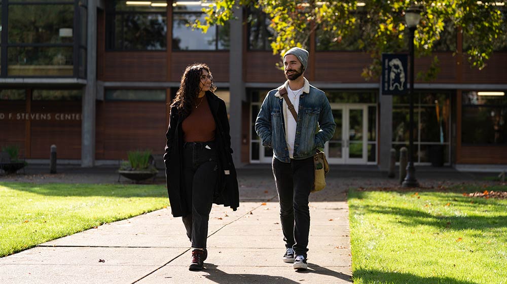 manesha walking with a student