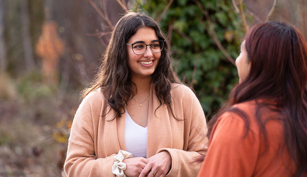 Manesha listening to a student