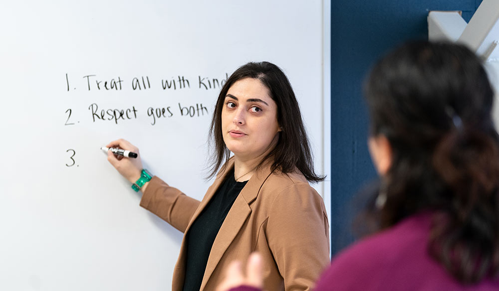 Brittany writing on a whiteboard