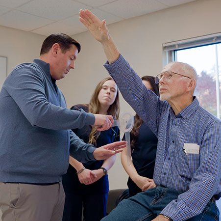 Trevor St. Clair taking care of an elderly client