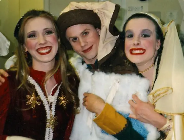 Hayley and two college friends smiling in stage makeup and costumes