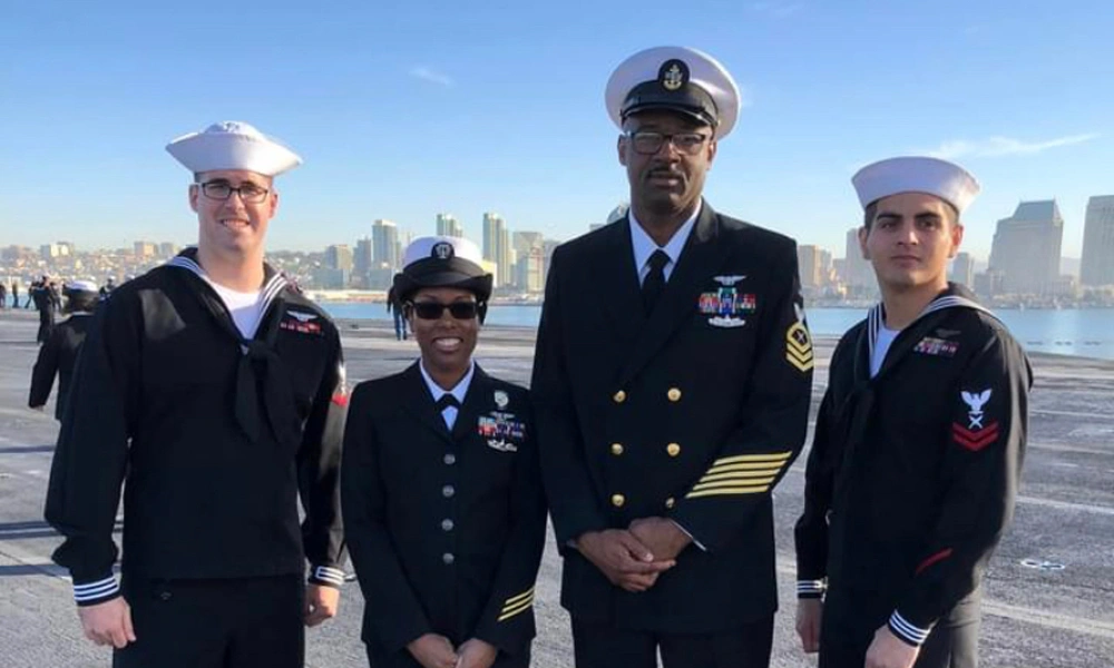 Prescilla Dorsey in her Navy uniform with 3 other sailors