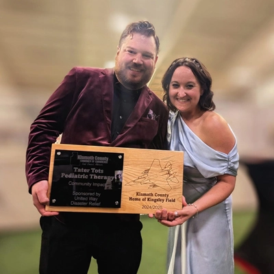 Taylor's practice receiving an award for community impact